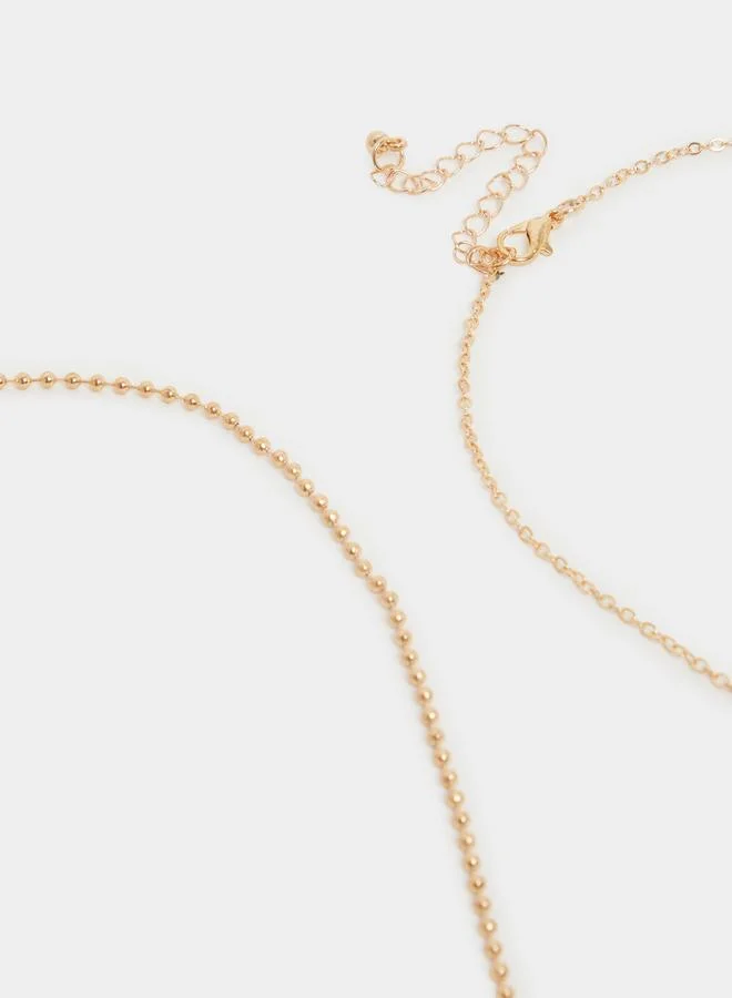 Styli  Pack of 4 - Gold Layered Charm Necklace for Women | Best Price UAE